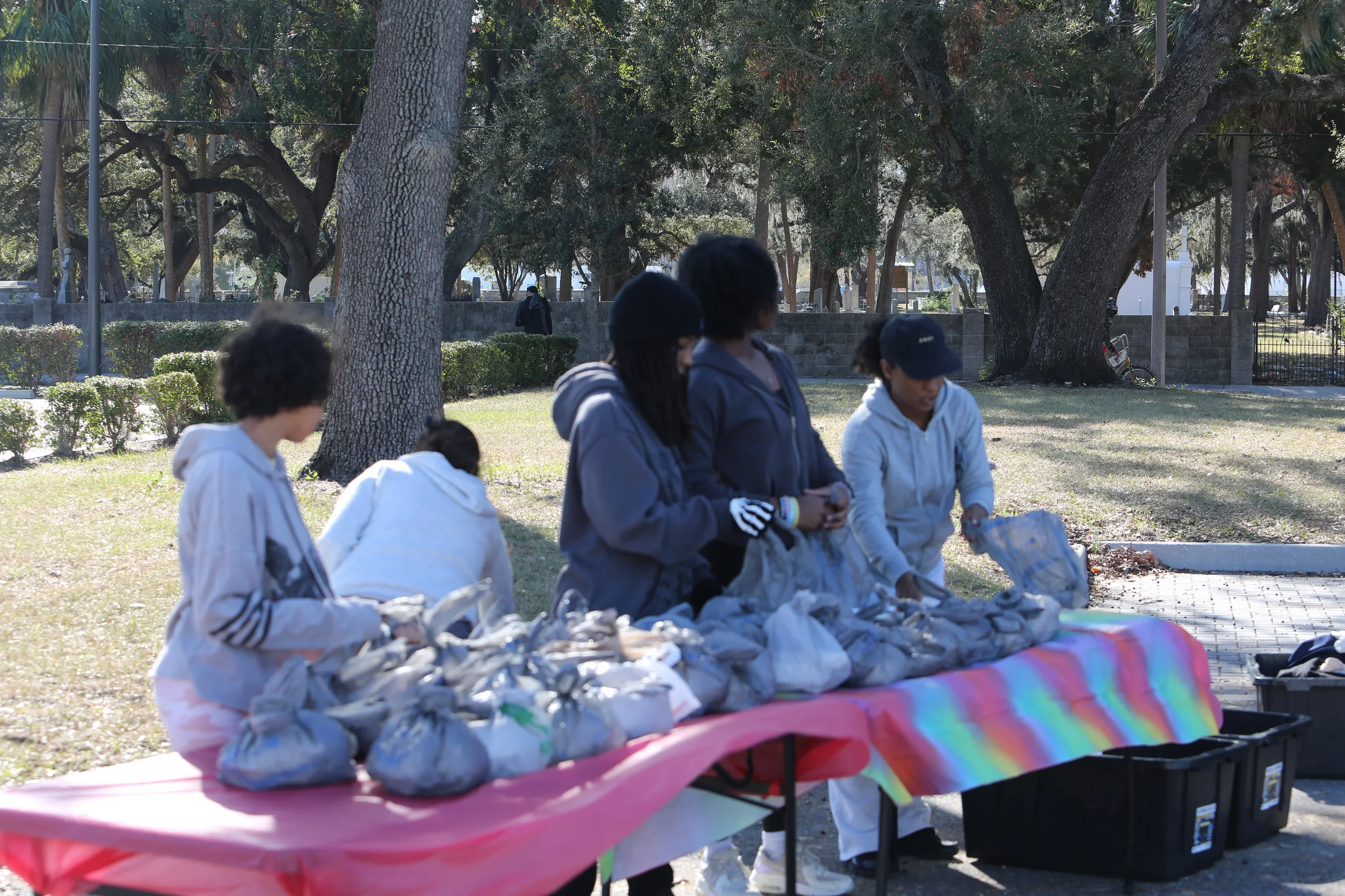 Volunteers preparing care bags at a community outreach site
