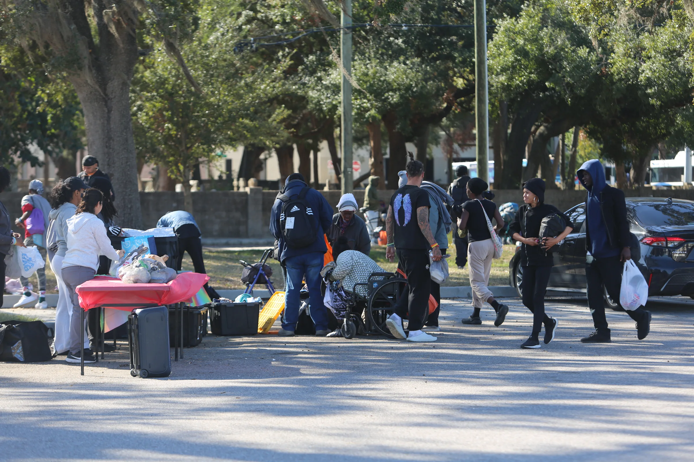 Community members and volunteers connecting during a Tampa outreach event